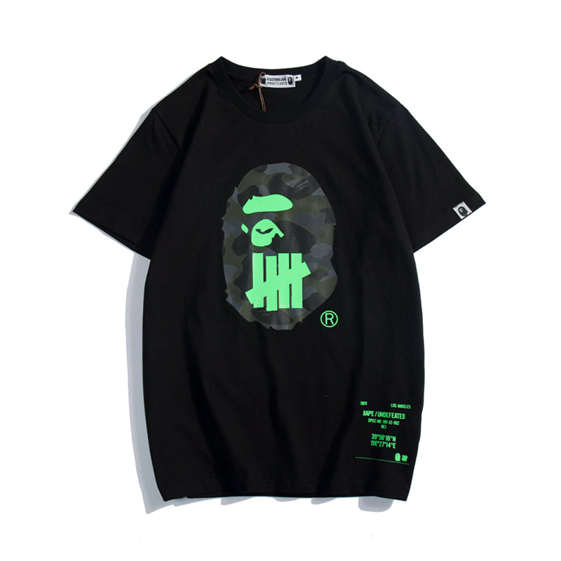 A BATHING APE® x WGM Undefeated Sport Is War Ape Head Tee